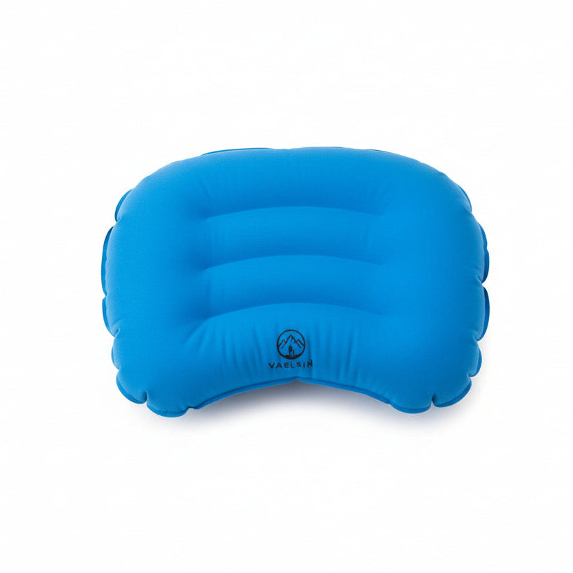 Blue inflatable pillow on a tiled floor