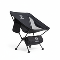 Black camping chair with carrying bag on a white background