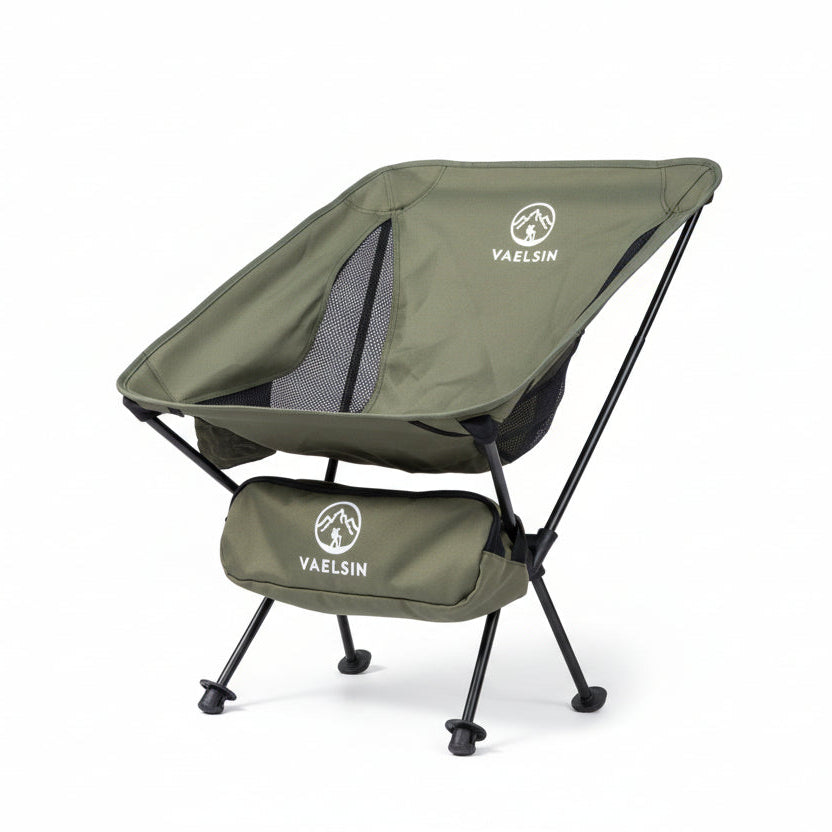 Green ultralight camping chair with white studio background