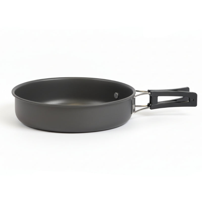 Black frying pan with a handle on a white background