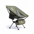 Green camping chair with carrying bag on a white background